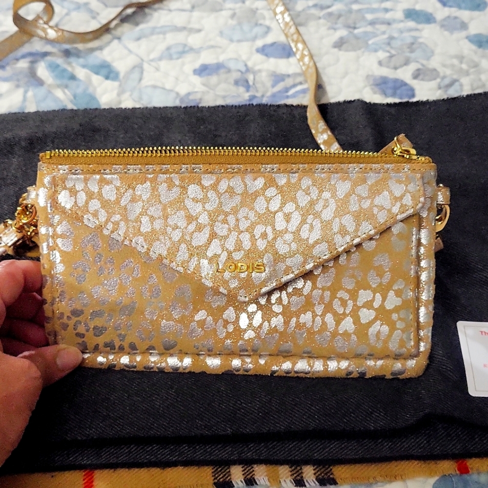 Lodis brand crossbody/wristlet. R.F.I.D. protection .